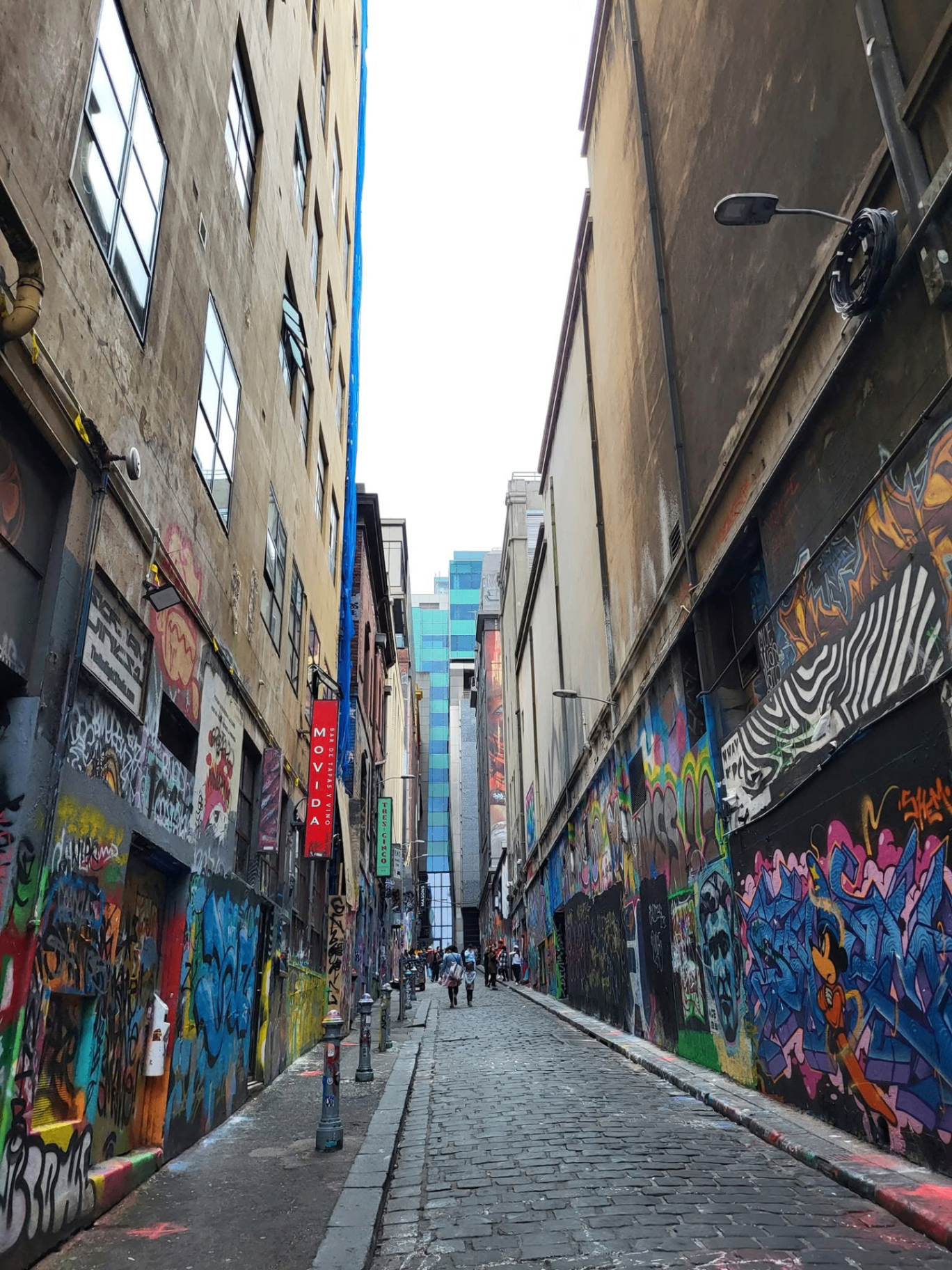 Hosier Lane in Melbourne, Australia, a narrow cobblestone alleyway covered in colorful street art
